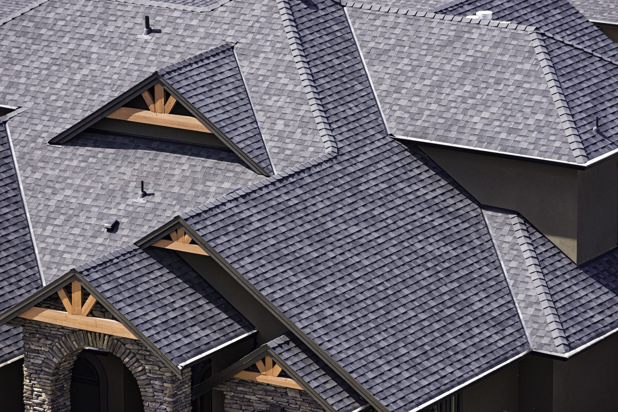 Aerial view of a home with asphalt shingle roofing
